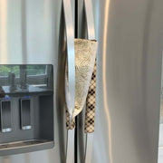 Brown and beige plaid fridge handle covers showing reverse.