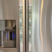 Puppy Print Fridge Handle Covers – Reversible on stainless steel refrigerator, adding charm and protection.