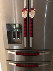 Red and black buffalo check appliance handle covers on a stainless steel refrigerator.
