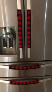 Red and black buffalo check appliance handle covers on a refrigerator, adding rustic farmhouse style and protection.