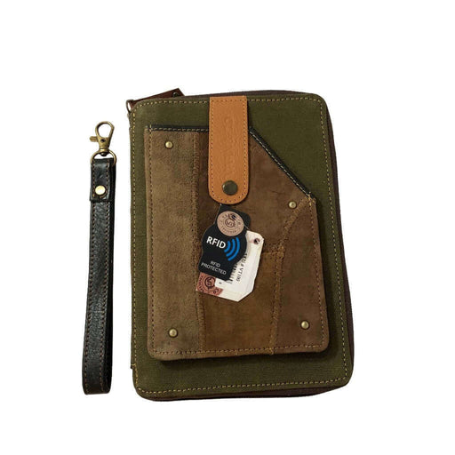 RFID passport utility wristlet featuring upcycled leather and canvas, RFID protection, and secure card slots.
