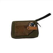 RFID passport utility wristlet showing card slots and outer passport holder in upcycled leather and canvas.