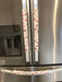 Rose pink snowflake appliance handle covers on refrigerator handles, adding a festive touch to kitchen decor.