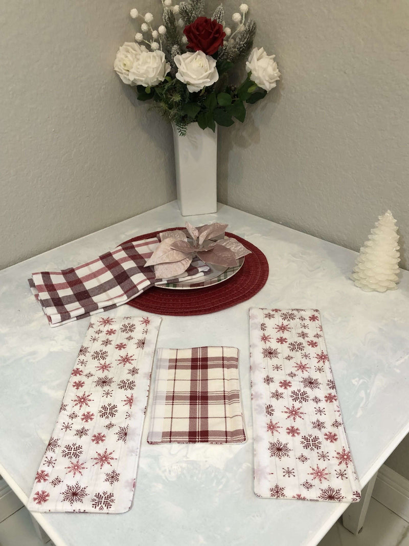 Rose pink snowflake appliance handle covers showcased on a festive kitchen table with decorative elements.