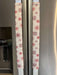 Rose pink snowflake appliance handle covers on refrigerator handles, adding a festive touch to kitchen decor.
