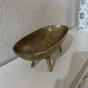 Rustic Brass Cast Iron Decorative Bowl on a shelf, showcasing artisanal craftsmanship and vintage appeal.