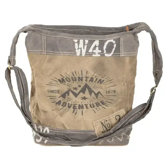 Rustic Canvas Crossbody Bag with Mountain Adventure design, adjustable strap, and spacious zippered pockets.