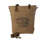 Sustainable canvas tote bag with Old Log Cabin Distilling Co. print, featuring a sturdy design and adjustable strap.