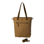 Sustainable canvas tote bag with sturdy handles and detachable strap, perfect for everyday use.