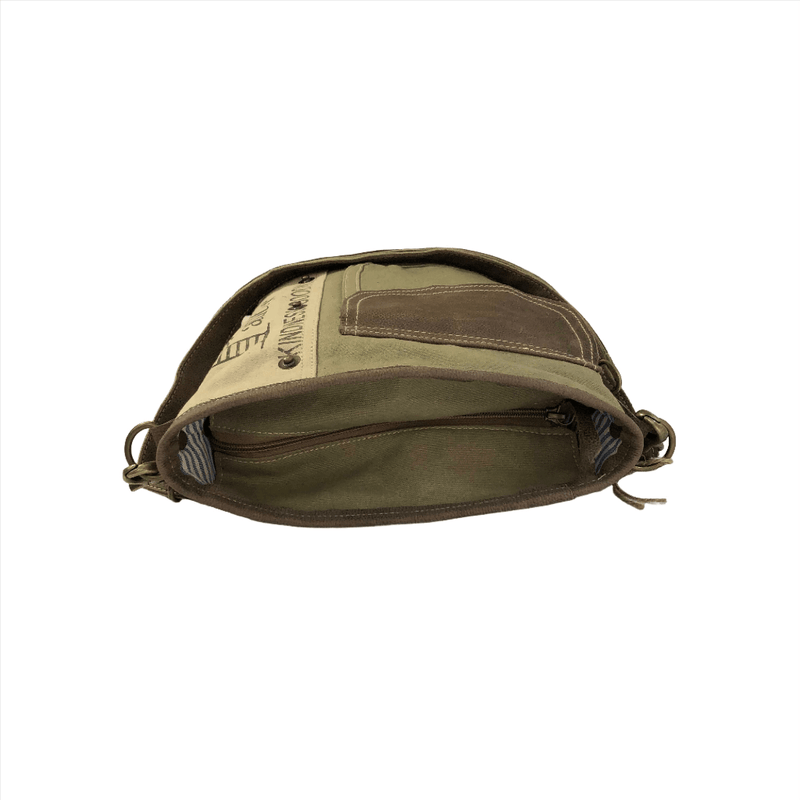 Upcycled canvas and leather crossbody bag showing interior compartments and zippers.