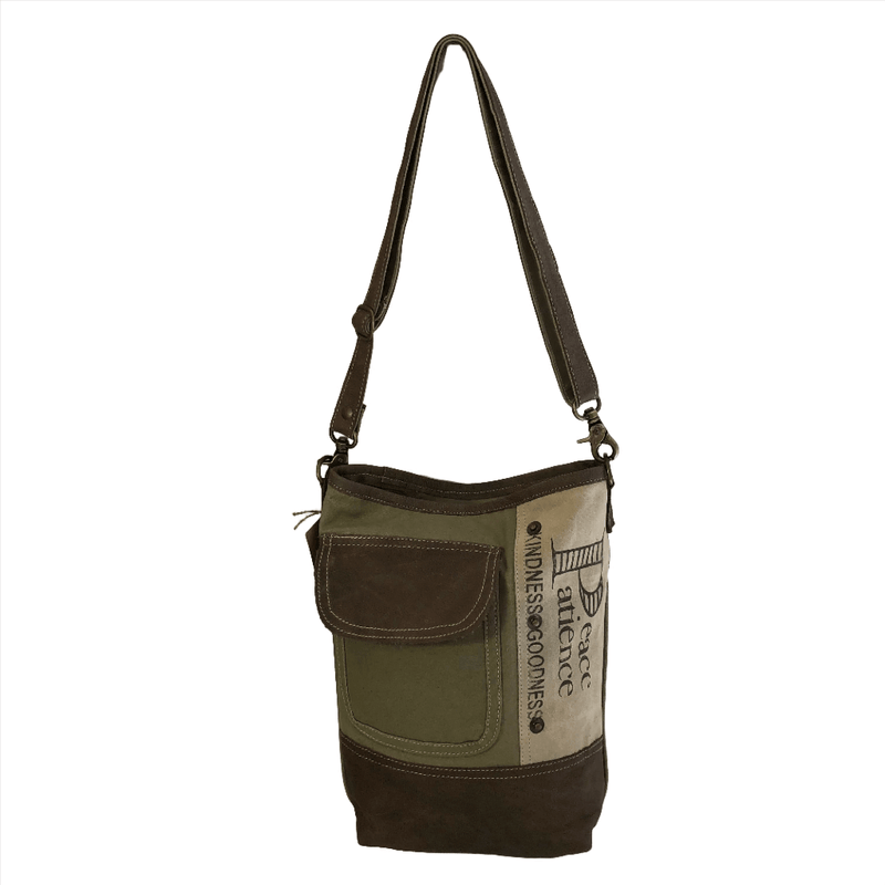 Upcycled canvas and leather crossbody bag for women with Peace and Patience design, ideal for casual day trips.
