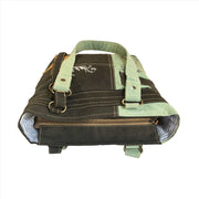 Upcycled canvas shoulder bag in grey and aqua with sturdy handles and zipper closure, showcasing rustic charm and eco-friendly design.