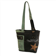 Upcycled canvas shoulder bag in grey with aqua straps, featuring a leather star and artistic designs.