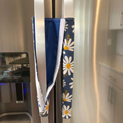 White and Yellow Daisies on Blue Appliance Handle Covers on a refrigerator handle.