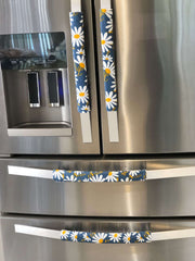 White and Yellow Daisy on Blue Appliance Handle Covers on stainless steel refrigerator handles.