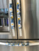 White and Yellow Daisy on Blue Appliance Handle Covers on stainless steel fridge handles.