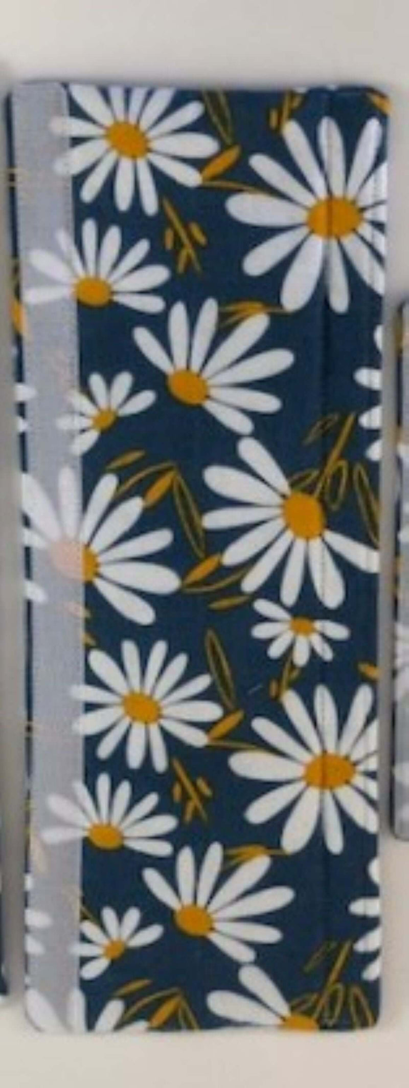 White and Yellow Daisy on Blue Appliance Handle Covers showcasing a floral design on a navy background.