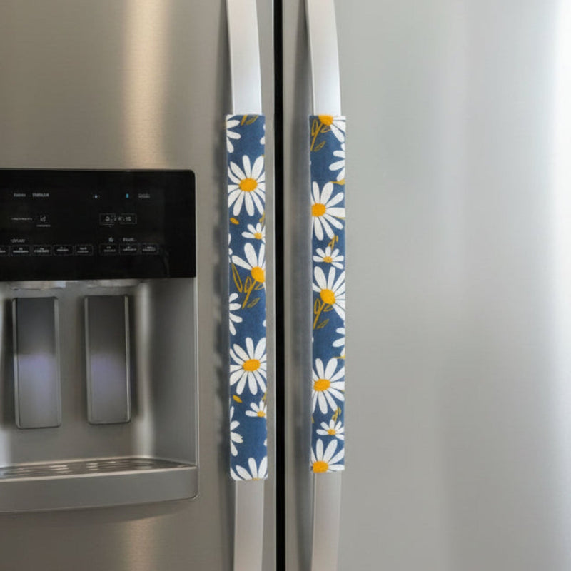 White and Yellow Daisies on Blue Appliance Handle Covers on refrigerator handles, adding charm and color to your kitchen.