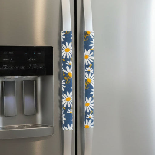 White and Yellow Daisies on Blue Appliance Handle Covers on refrigerator handles, adding charm and color to your kitchen.