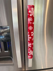 Winter Snowflakes Appliance Handle Covers on refrigerator doors for a festive kitchen look. 1V