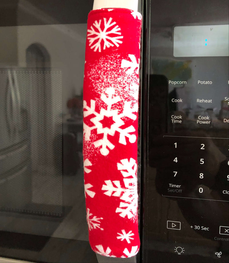 Winter Snowflakes Appliance Handle Covers on microwave, adding festive flair to kitchen decor.