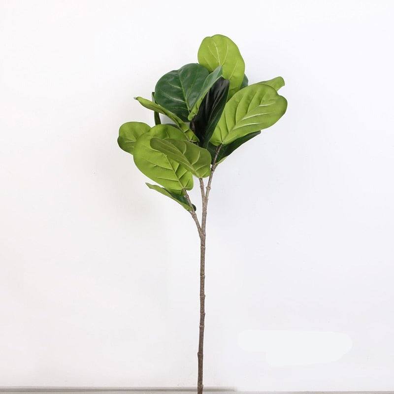 Large realistic artificial ficus tree showcasing lush green leaves and a textured brown stem for home decor.