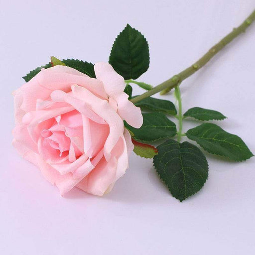 Realistic Artificial Rose Stem with pink bloom and green leaves for home decor and floral arrangements.