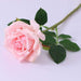 Realistic Artificial Rose Stem with pink bloom and green leaves for home decor and floral arrangements.